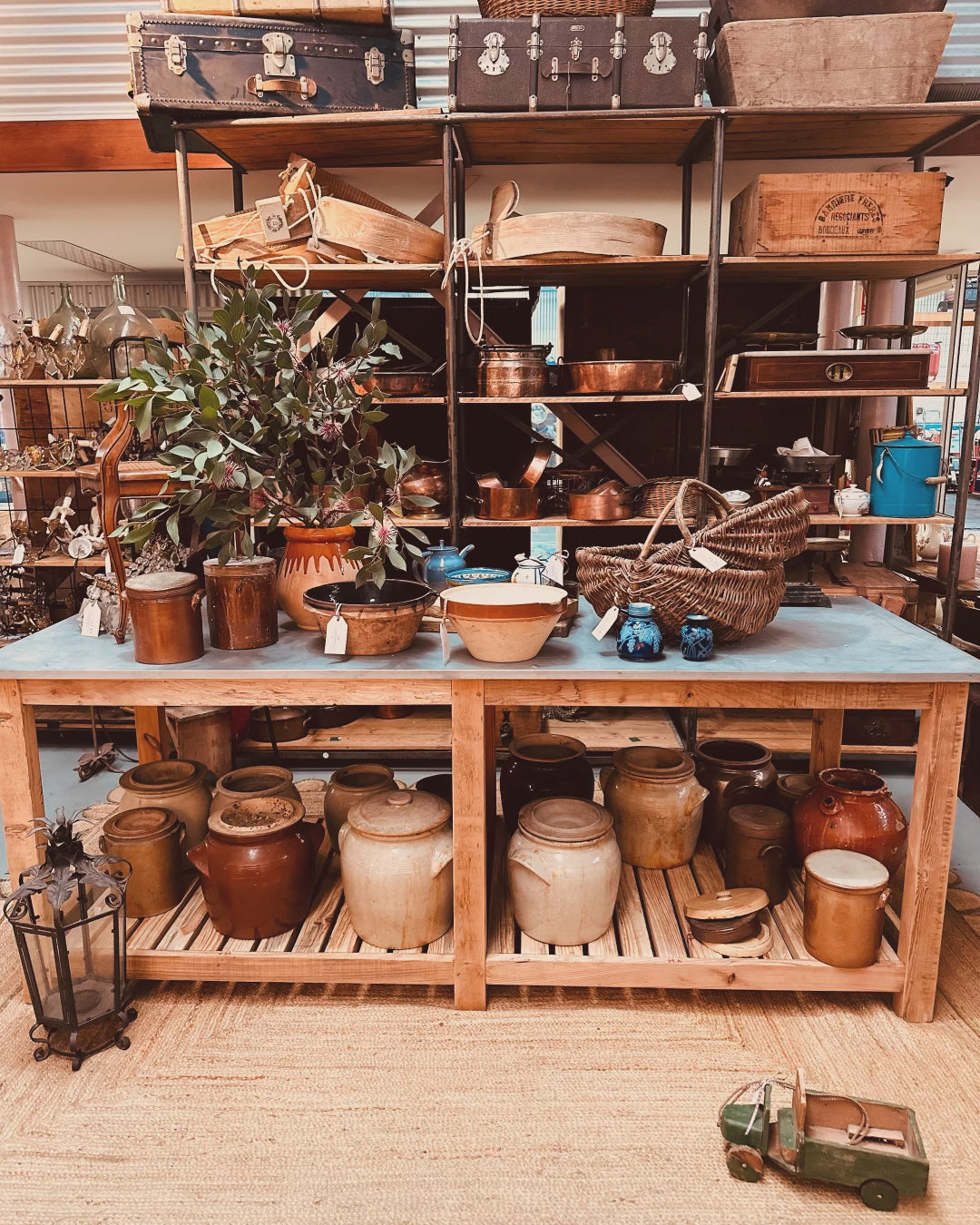 An impressively high kitchen island/work bench with zinc top made by a local timber craftsman in the French Alps from reclaimed antique French oak.