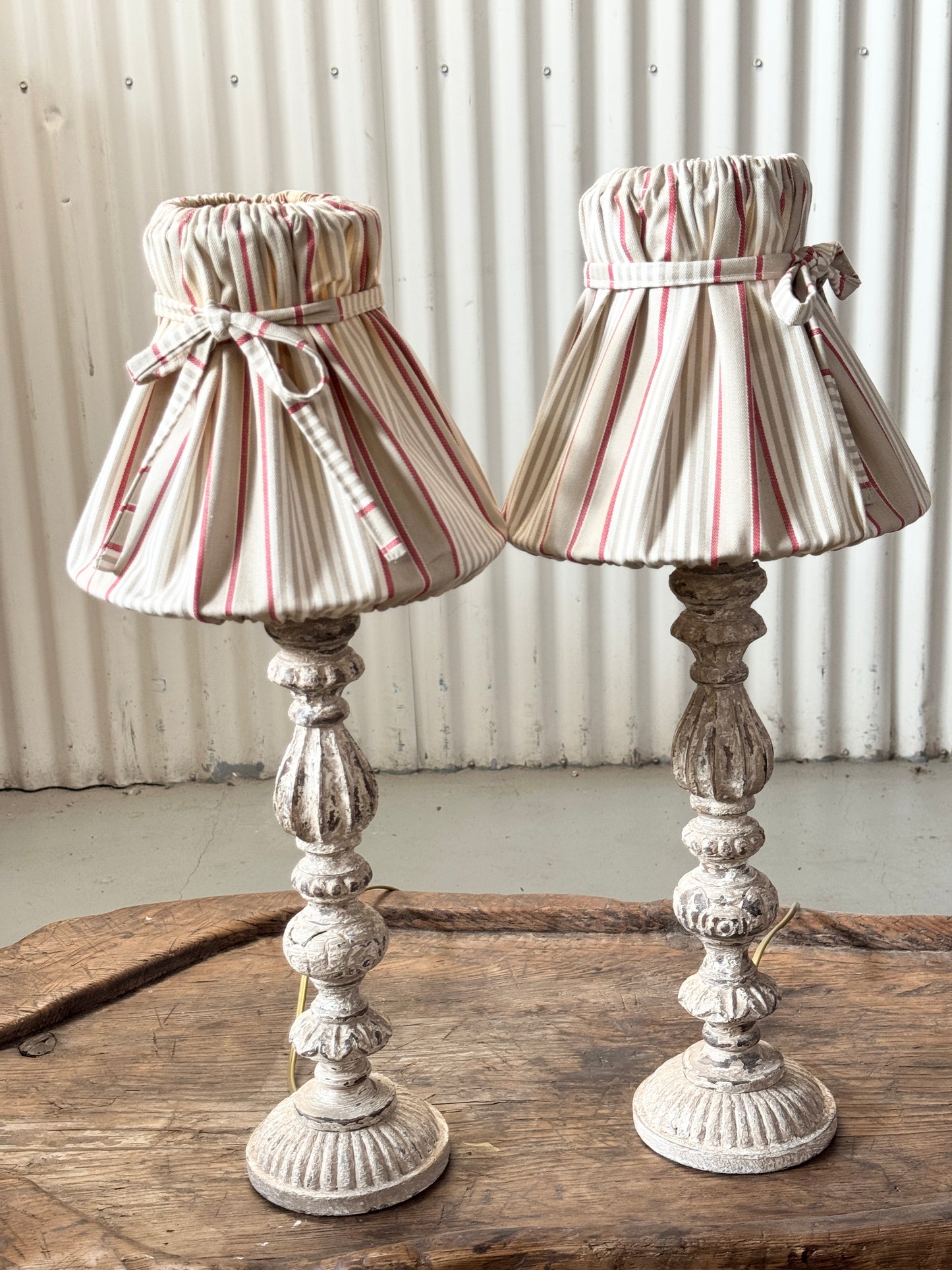 A pair of lovely aged lamps from Provence with charming upholstered shades and an aged cream/gray painted patina