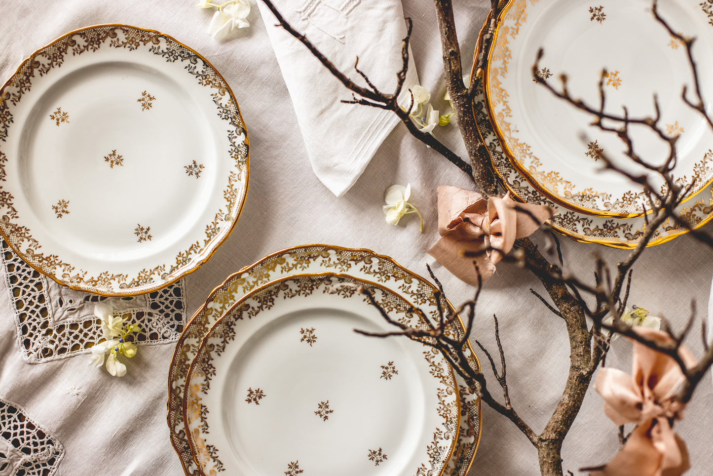 Antique French 'Limoges' 49-piece dinner set with beautiful floral and lace gold leaf design with gold painted edges.