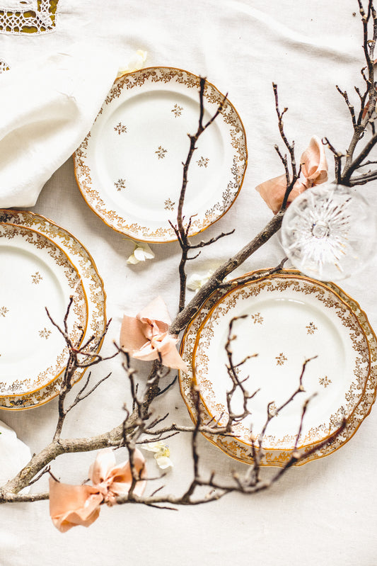 Antique French 'Limoges' 49-piece dinner set with beautiful floral and lace gold leaf design with gold painted edges.