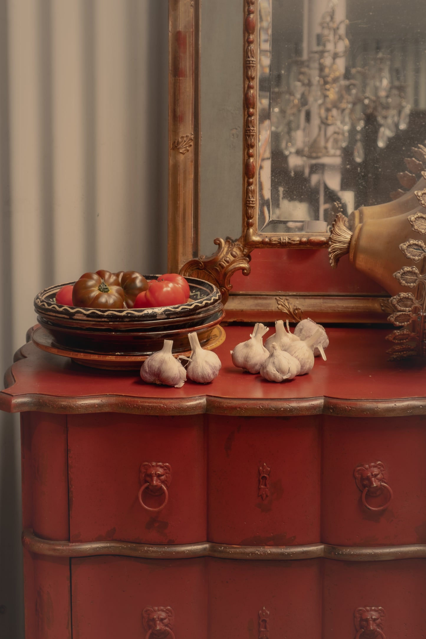 Statement Antique French 18th Century Louis XV style commode with red patina and gracefully curved serpentine front from Provence