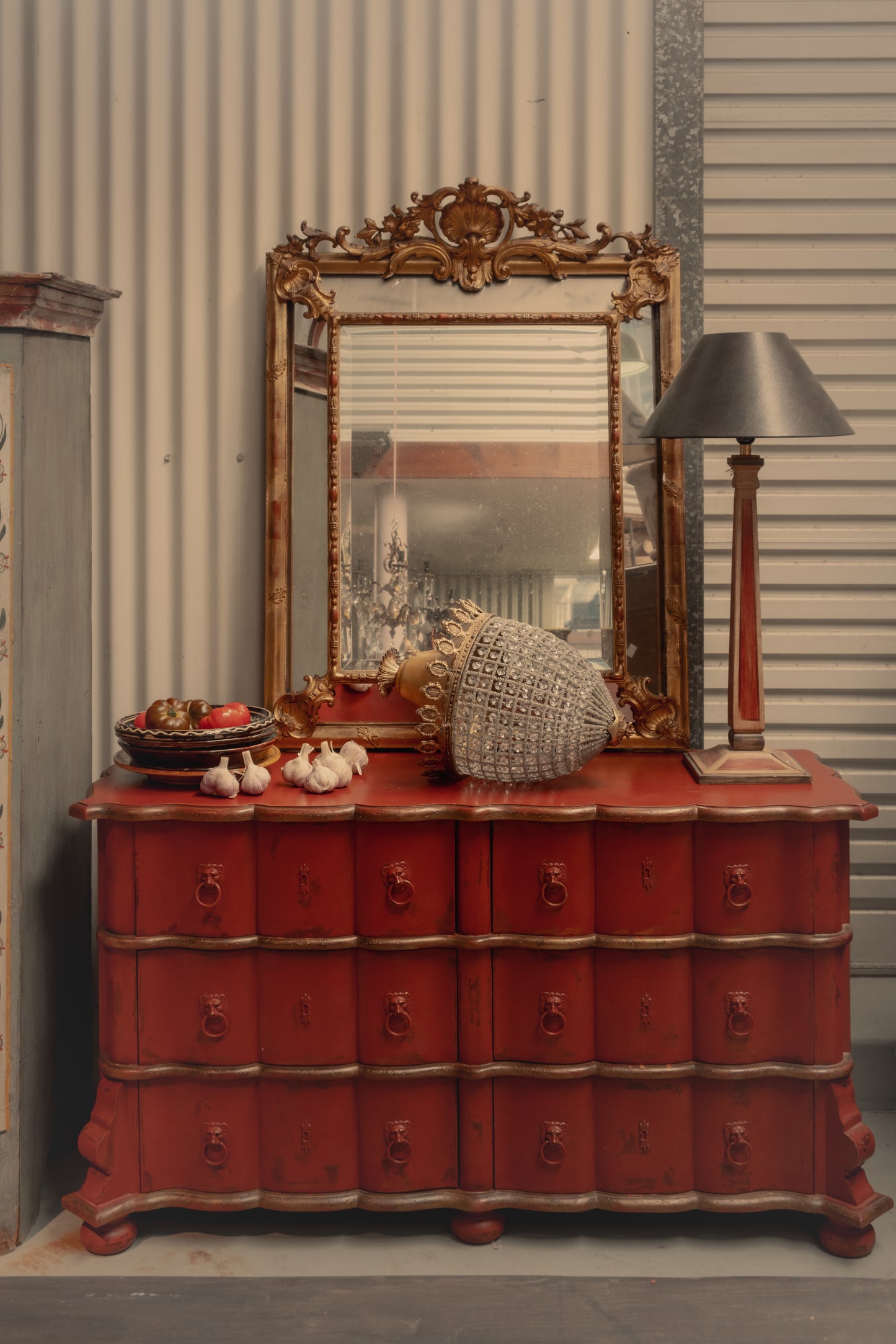 Statement Antique French 18th Century Louis XV style commode with red patina and gracefully curved serpentine front from Provence