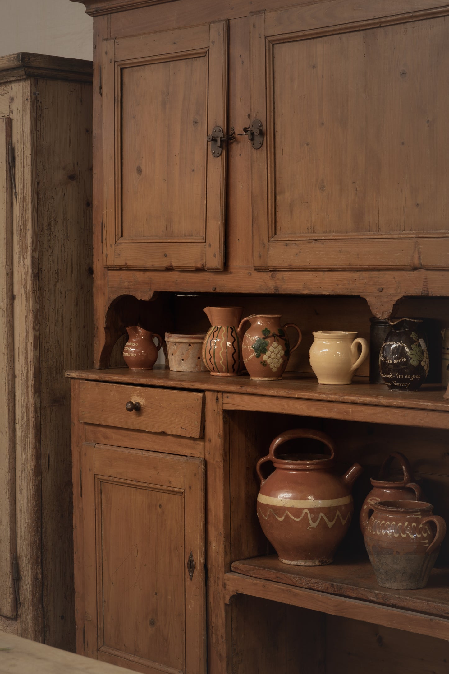 Beautiful Antique French 19th century farmhouse buffet deux corps crafted from solid pine or fruitwood in a warm honey-toned wood patina, hand-cut joinery and iron hardware from the Alps
