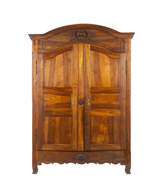 Antique French 19th Century Walnut armoire with beautiful carvings to the facade from Provence.