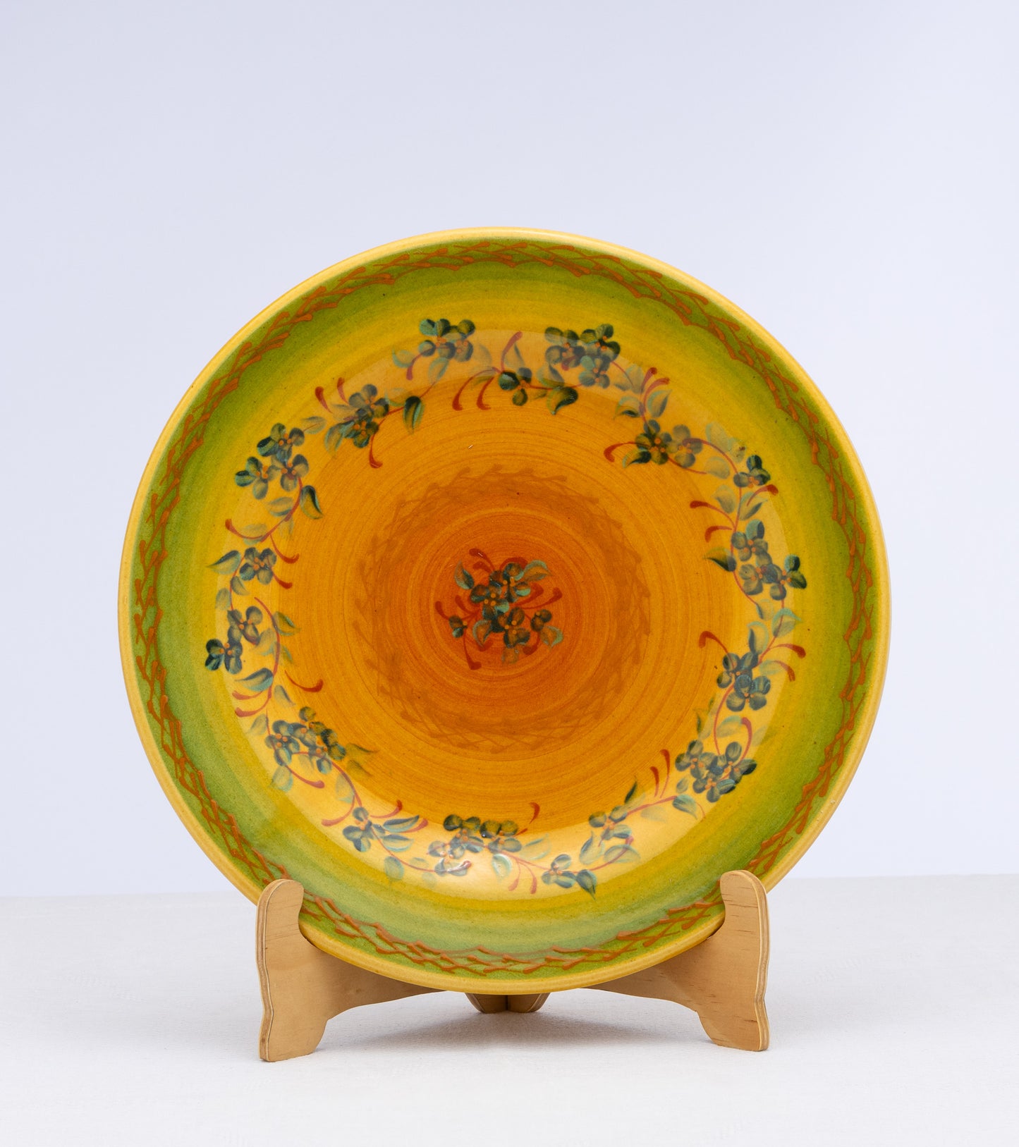 Vintage French heavy ceramic plate with yellow glaze and hand painted floral motifs and makers mark 'Terre de Provence'