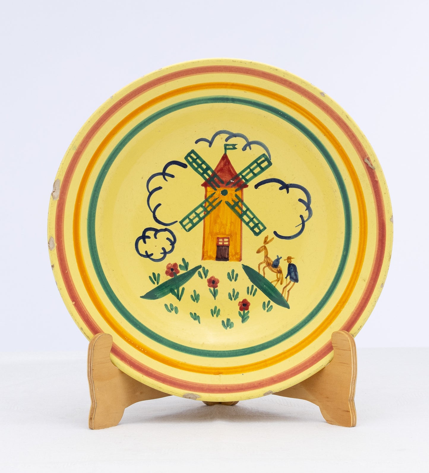 Vintage French hand painted yellow bowl with windmill and striped design signed Quimper