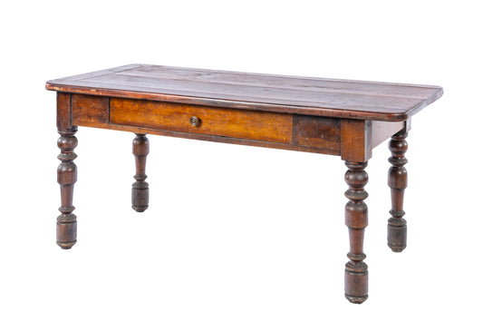 A lovely antique French cherrywood table with large side drawer and a lot of rustic charm from the French Alps