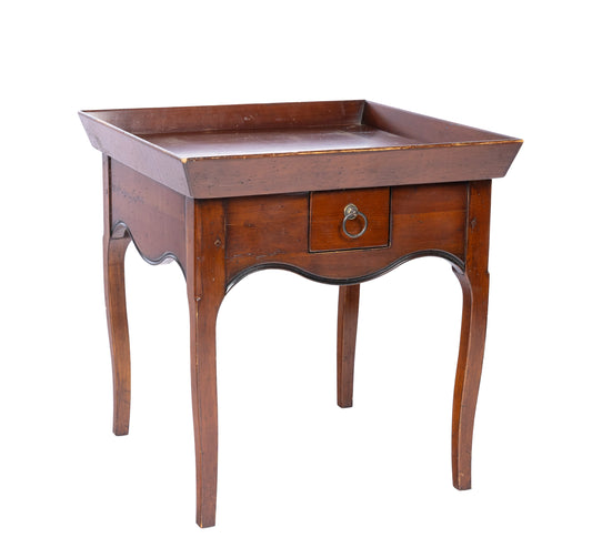 An elegant vintage French side table from a hotel in Courchevel in the French Alps. Featuring a tray top design and single drawer with brass handle.