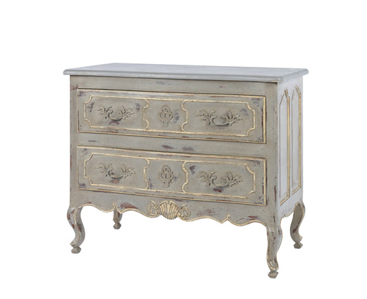 Antique French Louis XV style commode with a lovely time worn grey patina and hand carved coquille shell carvings and raised panel drawer fronts from Provence