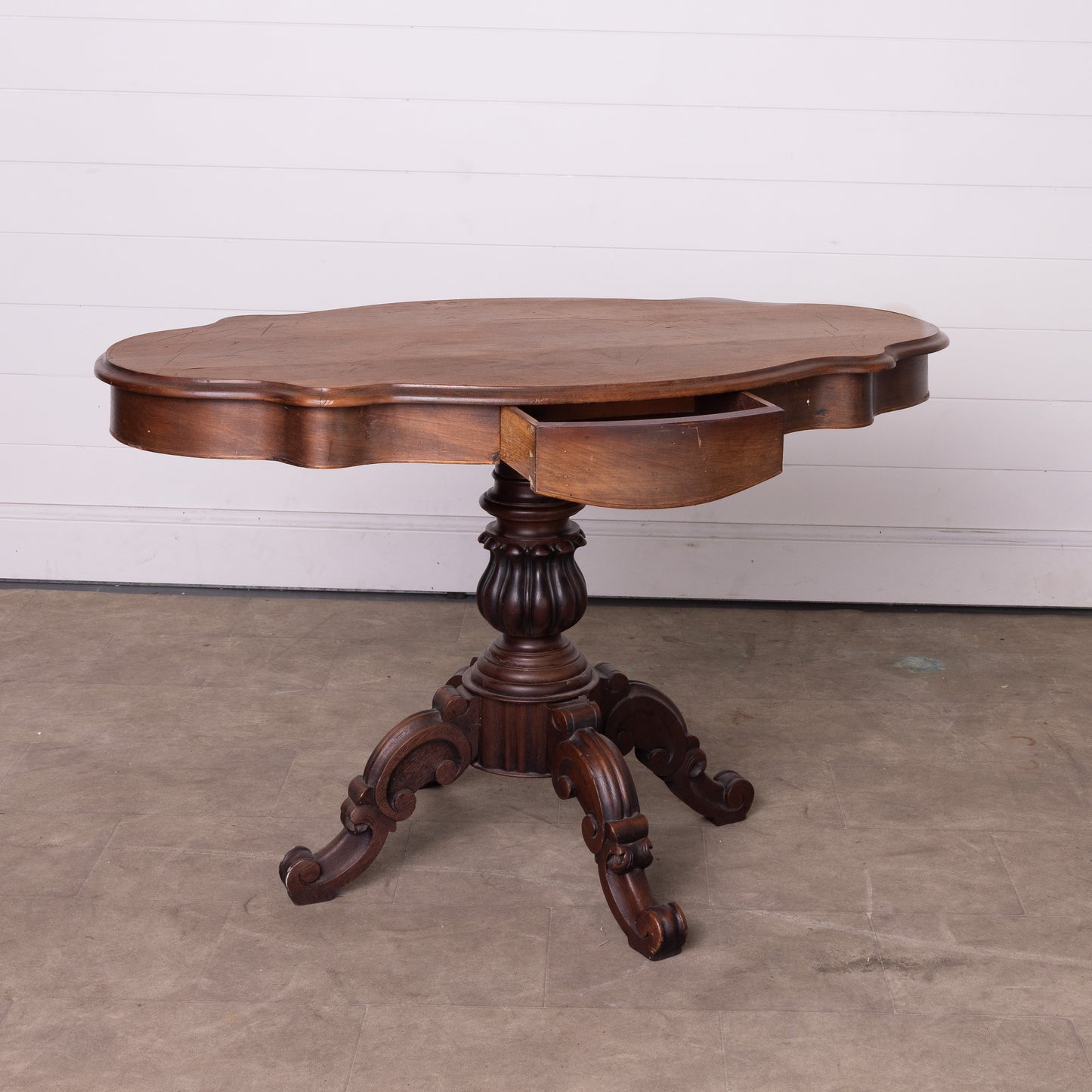 Antique French Walnut Gueridon pedestal table with scalloped edges and decorative pillar from Lyon