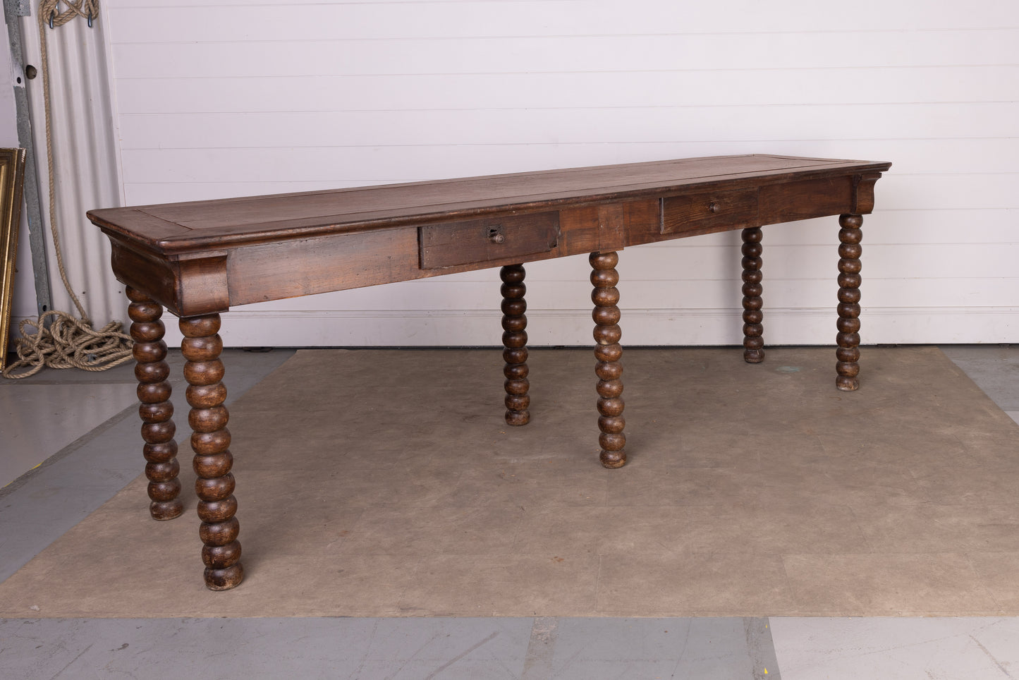 Impressive solid walnut console table with bobble legs and two drawers from Lyon
