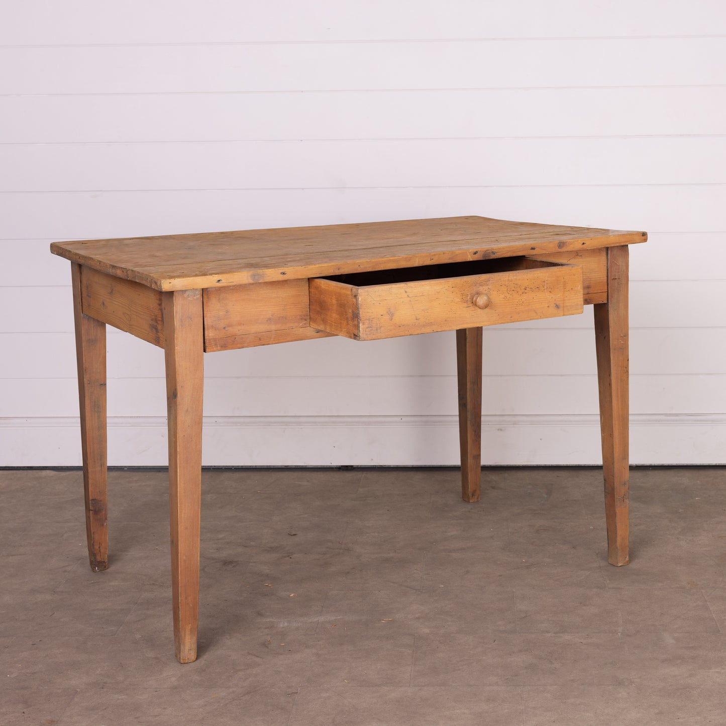 Lovely vintage French Pine dining table or desk with tapered legs and central drawer from the Alps