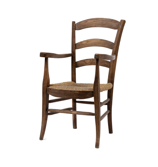 Lovely vintage French carver armchair with rush seat. Discovered in Provence.