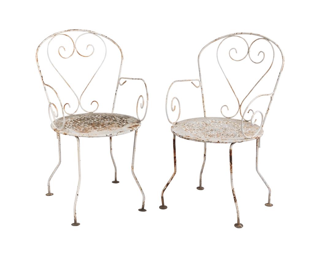 Pair of vintage 20th Century French wrought iron arm chairs. Discovered in the French Alps