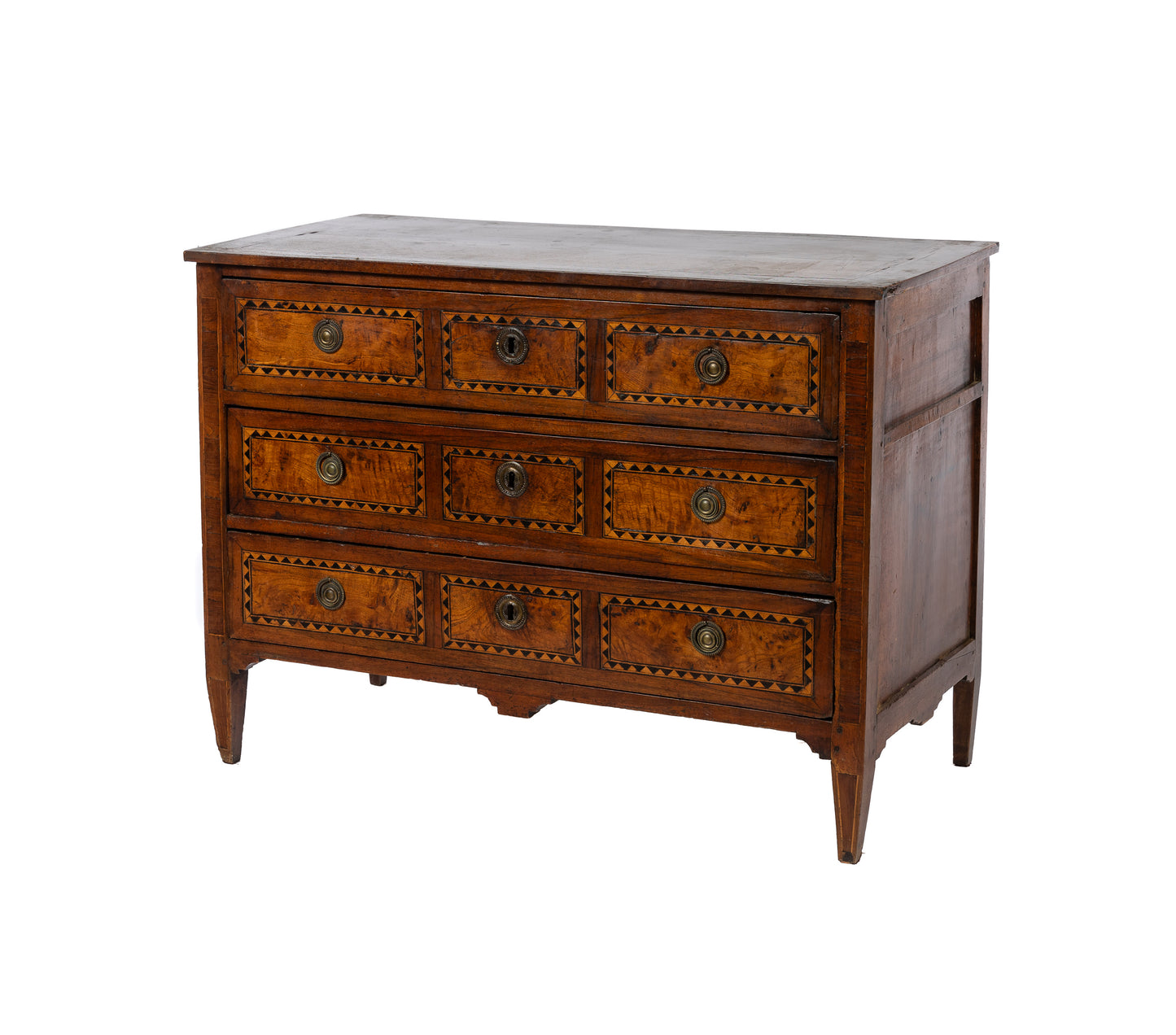 A collectible, high-end 18th Century 3-drawers commode with beautiful fruitwood and dark ebony inlaid triangle details, original brass drawer hardware and simple tapered legs