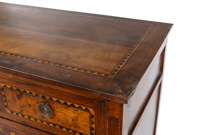 A collectible, high-end 18th Century 3-drawers commode with beautiful fruitwood and dark ebony inlaid triangle details, original brass drawer hardware and simple tapered legs