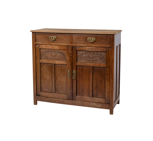 Gorgeous 19th Century Antique French oak sideboard with lovely timber flower carvings and brass hardware. Discovered in The French Alps