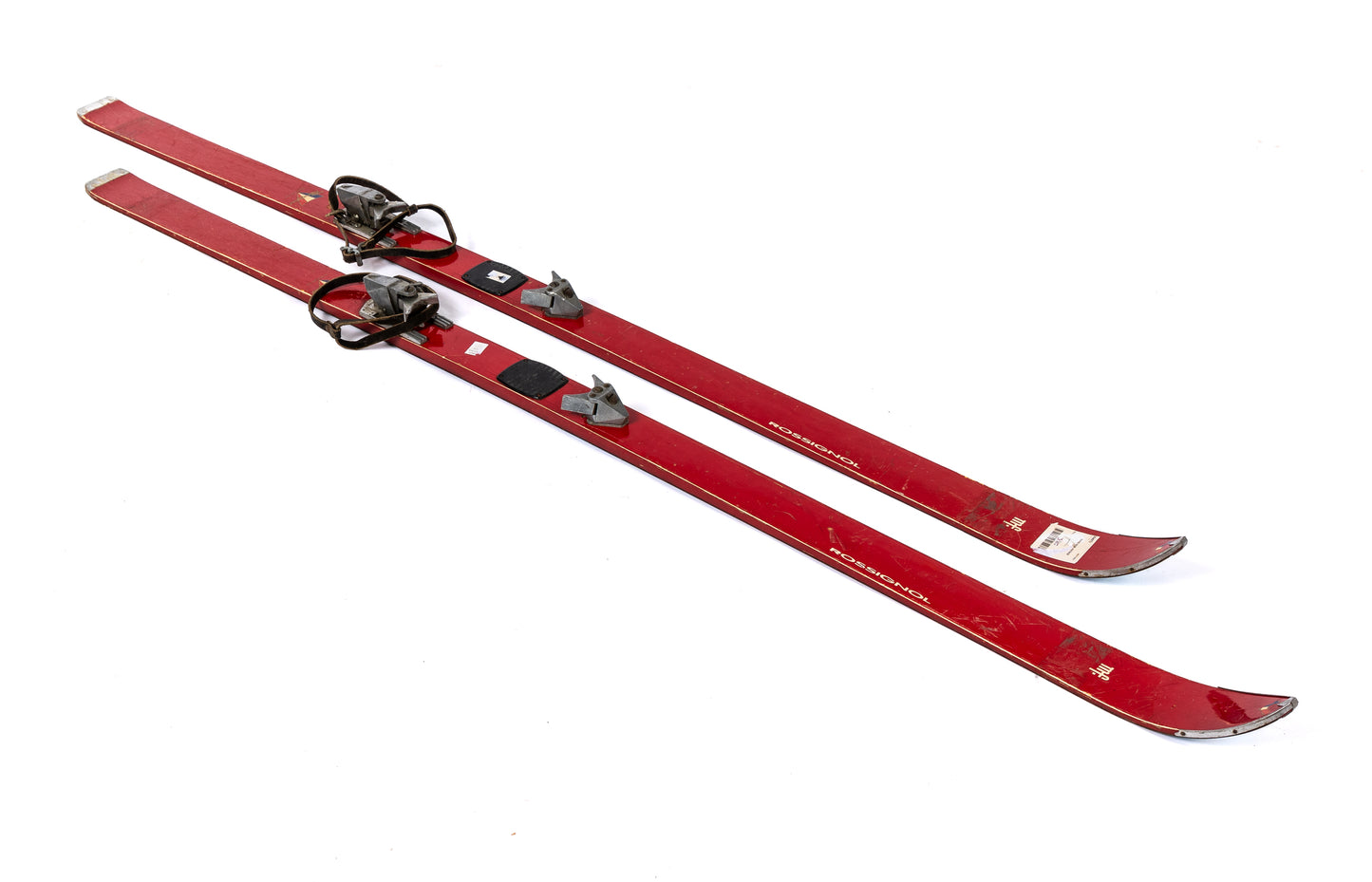 A retro pair of French skis - red Rossignol with original bindings. Discovered in The French Alps