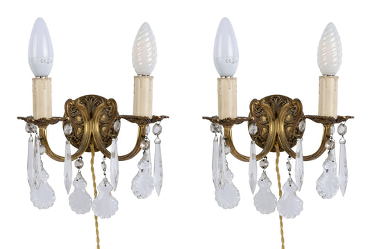 A superb pair of antique French brass wall sconces with a lovely variety of clear crystal drop gems