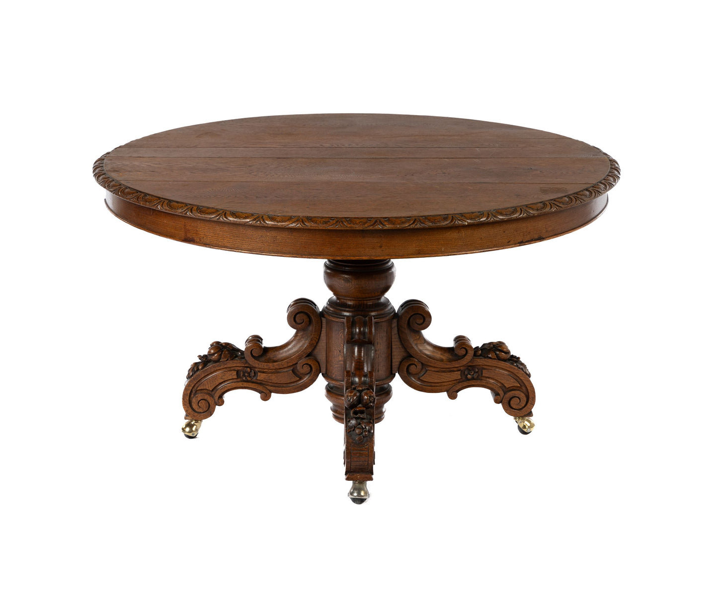 Charming 19th Century antique French oak solid pedestal table with intricate carved base.