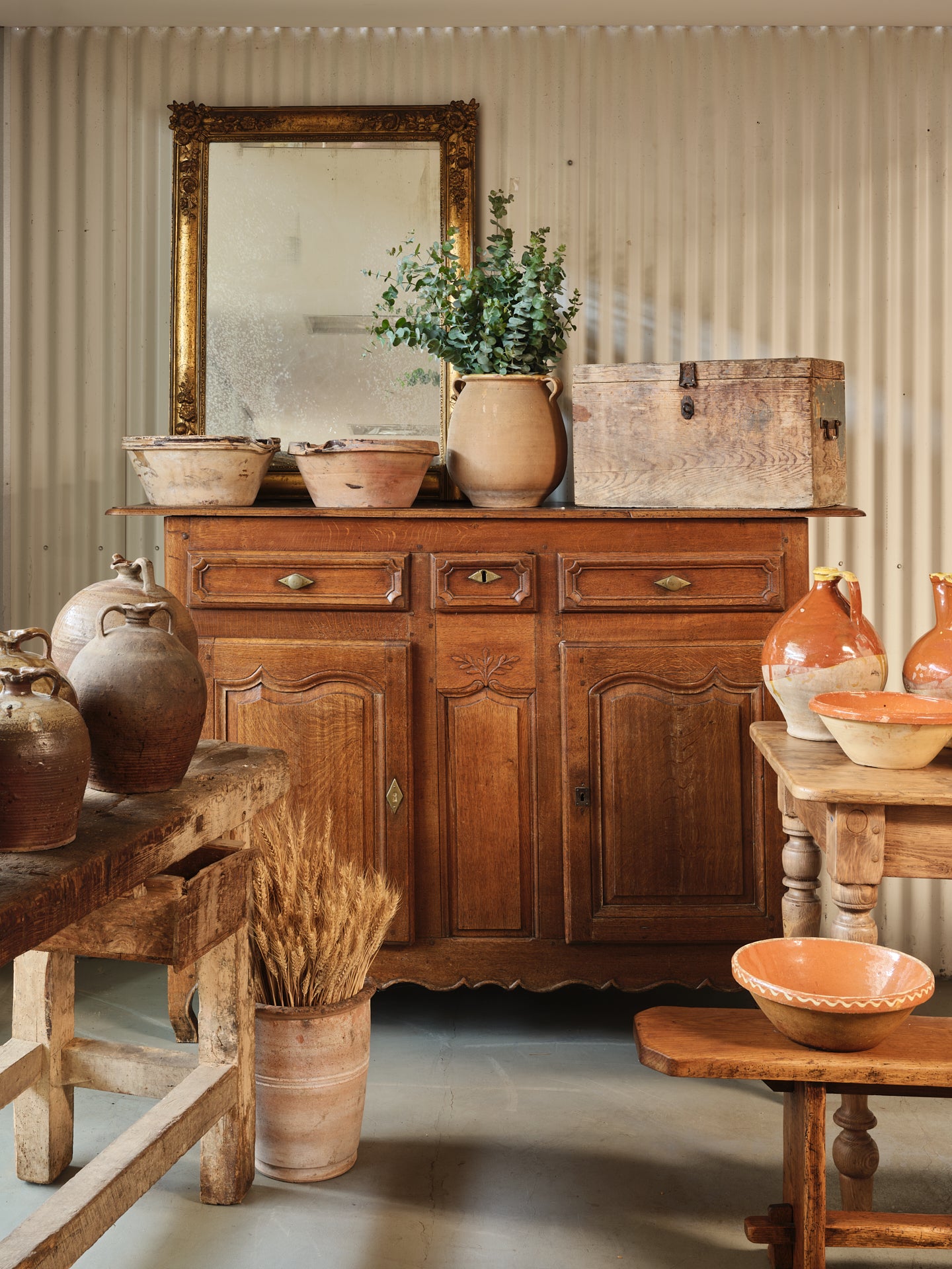A charming 19th century antique French oak sideboard with brass hardware and some lovely timber carvings found in a grocery shop, in the French Alps.
