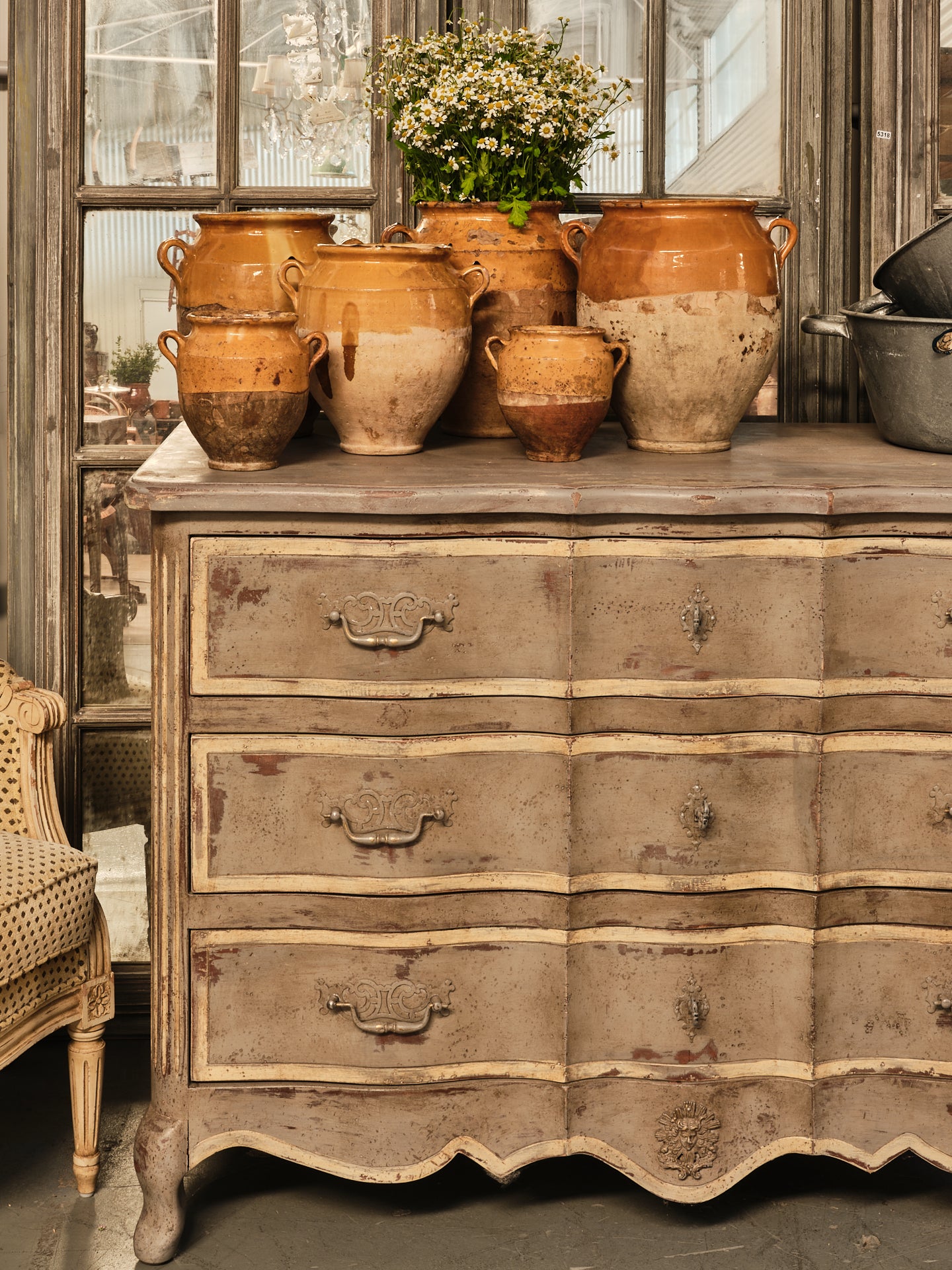 Antique French three drawer commode from Provence with a grey patina