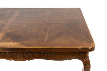 19th Century Antique French walnut Louis XV Style extendable dining table with floral hand carvings from Provence