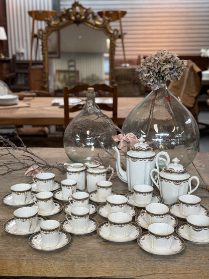 Delicate Antique French porcelain tea and coffee cup and saucers set from Paris.