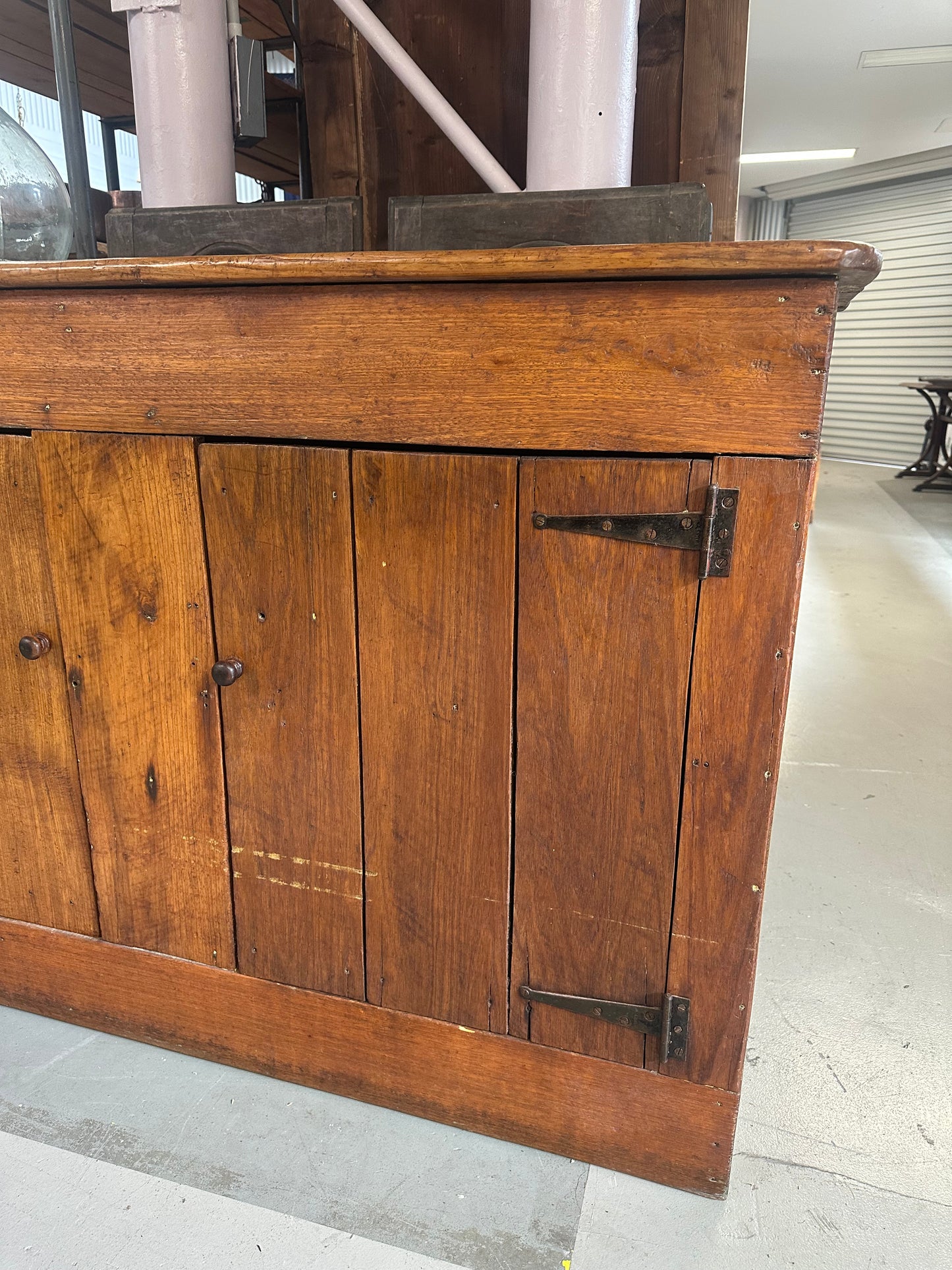 Vintage walnut farmhouse sideboard featuring internal shelves and a warm honey-coloured finish