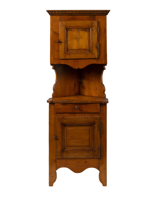 Antique French Alpine corner cabinet with lovely scalloped details and ample storage space