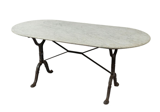 Stunning vintage French Carrara marble top table with solid wrought iron base. Discovered in a boutique hotel in Provence