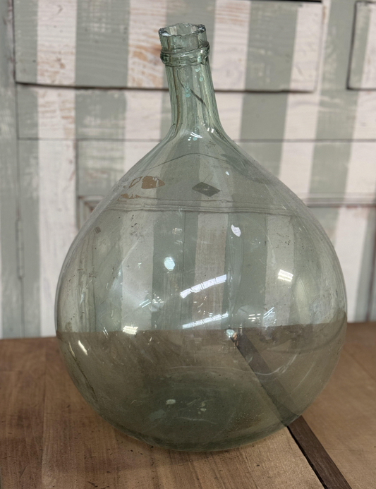 A gorgeous large green demijohn blown glass wine makers bottle, from Provence