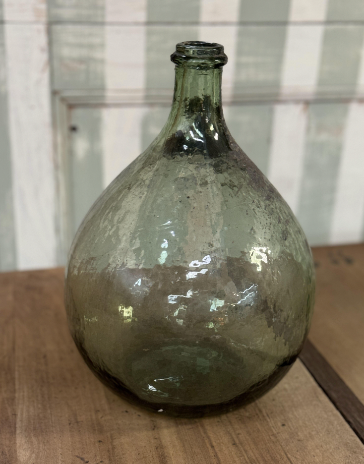 A gorgeous large green demijohn blown glass wine makers bottle, from Provence
