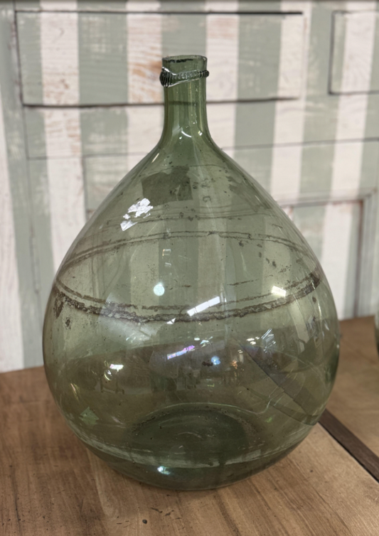 A gorgeous large green demijohn blown glass wine makers bottle, from Provence
