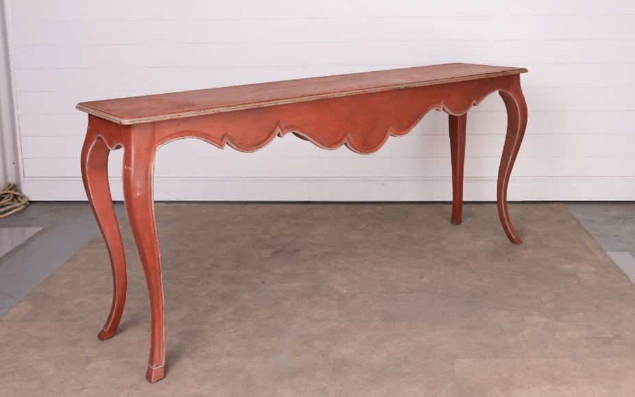 Impressive large vintage French red narrow console hall table with scalloped design and gold edging