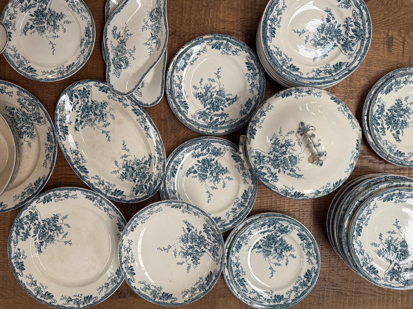 A beautiful and extensive 47-pieces antique French dinner service by Longwy, in the delicate Azalées pattern.
