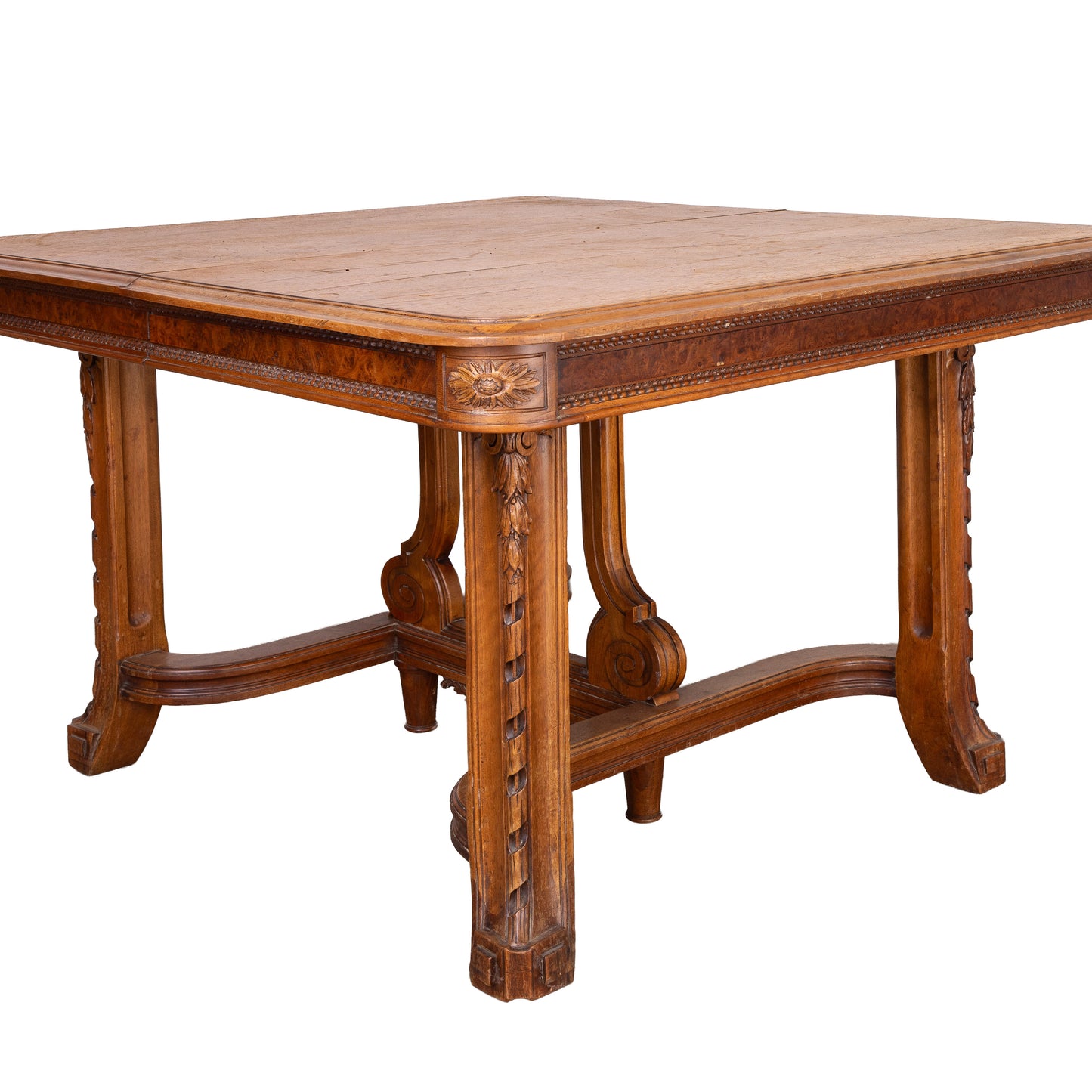 Antique French oak extendable dining table with intricate carvings and detailed stretcher base from Provence