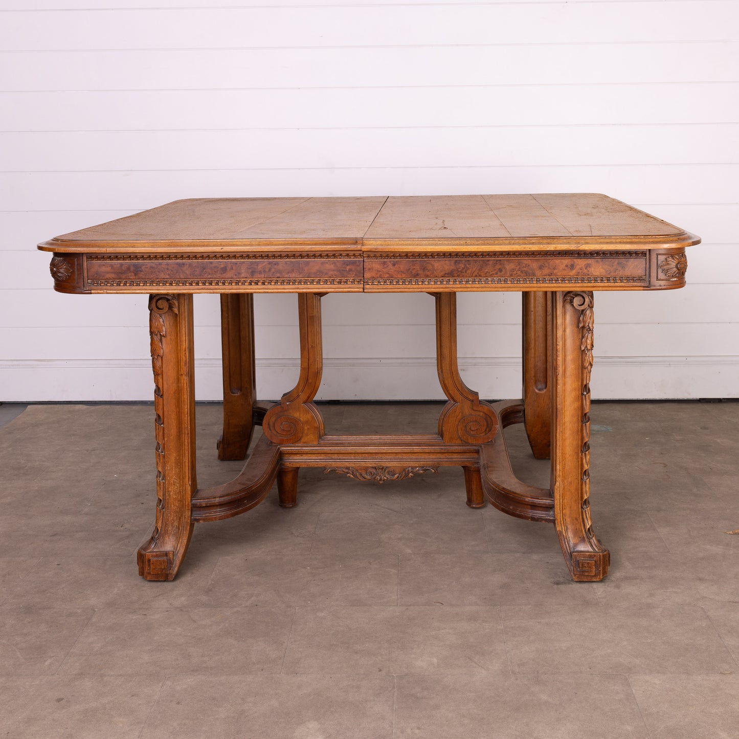 Antique French oak extendable dining table with intricate carvings and detailed stretcher base from Provence