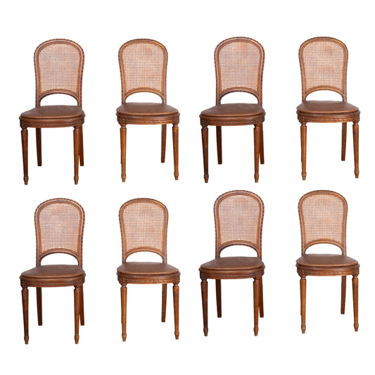 Set of 8 Antique French cane bistro dining chairs with removable leather seat pads