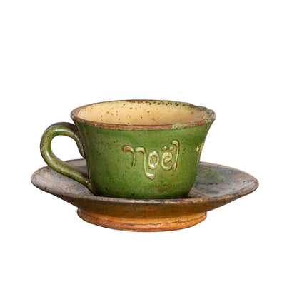 Charming Vintage French Artisan made teacup and saucer in a green and yellow glaze inscribed 'Noel' from Provence