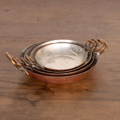 Set of 4 stackable shallow copper serving pans with brass handles from Provence