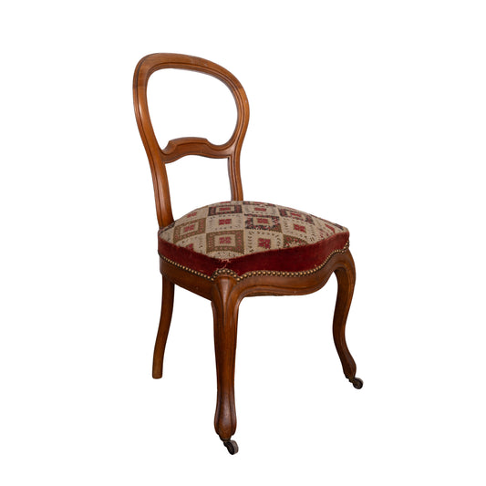 Lovely Vintage French Walnut salon chair with cross-stitch upholstery and small castors