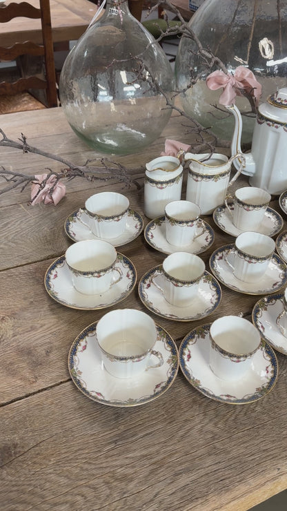 Delicate Antique French porcelain tea and coffee cup and saucers set from Paris.