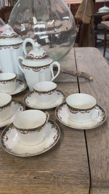 Delicate Antique French porcelain tea and coffee cup and saucers set from Paris.