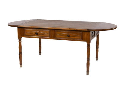 20th Century antique French walnut farmhouse table with foldable sides with 4 drawers from Provence.