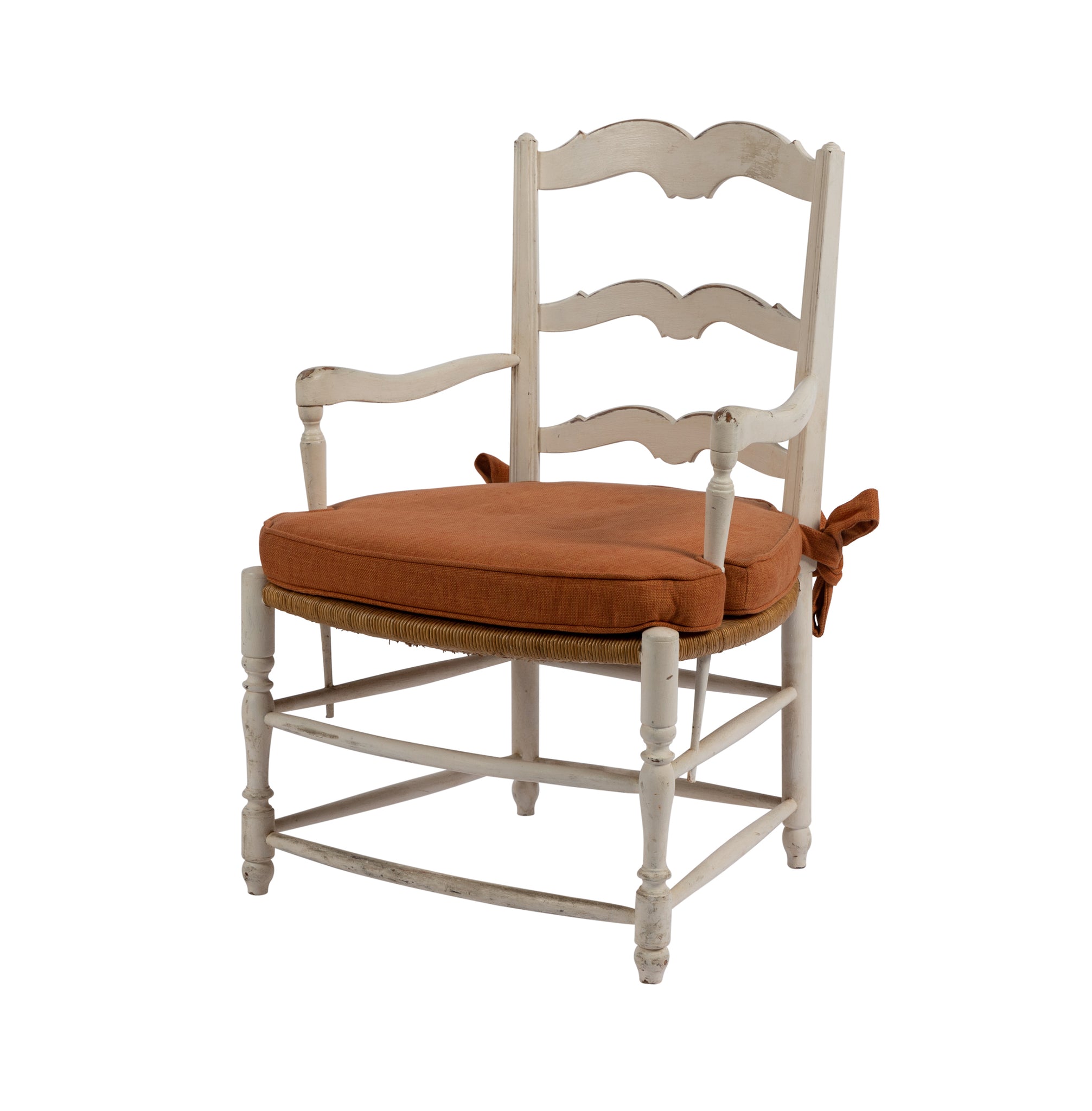 Gorgeous white ladderback armchair with rush seat and orange cushion from Provence