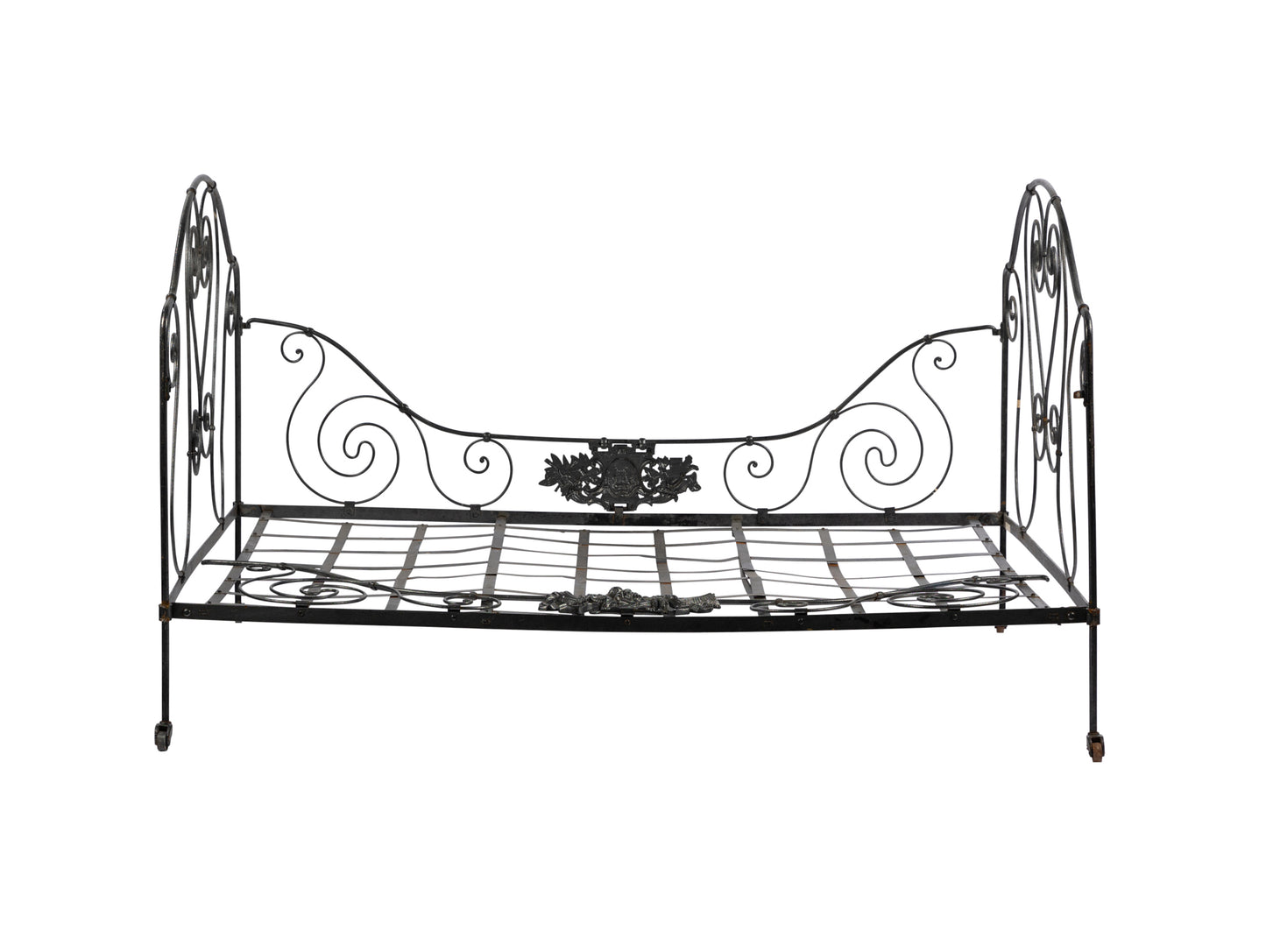 Beautiful and large daybed with lovely hand forged iron motifs from a hotel courtyard in Lyon