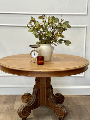 A stunning early 20th Century French oak pedestal table with impressive base