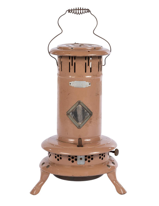 A 20th Century antique oil burning "dusty pink" stove from the French Alps.