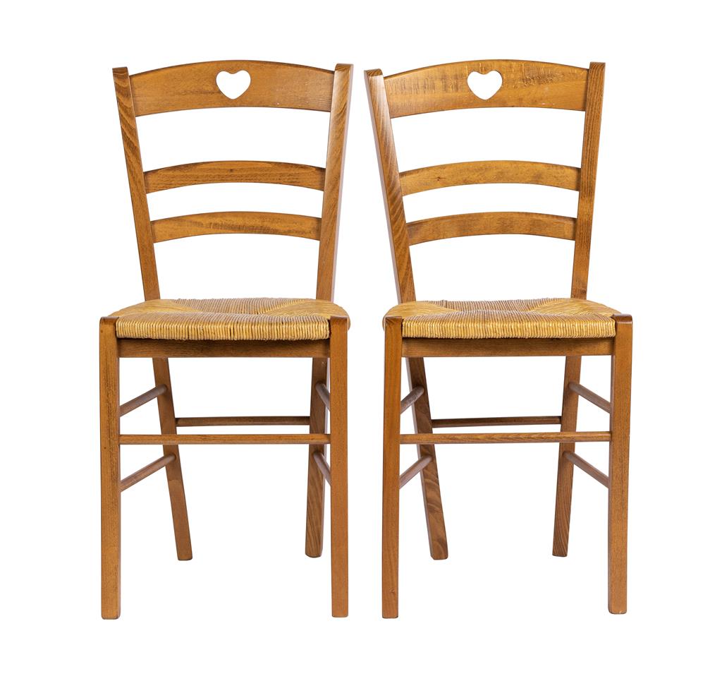 A pair of charming wicker chairs with heart cut outs on the backrest from a chalet in Chamonix